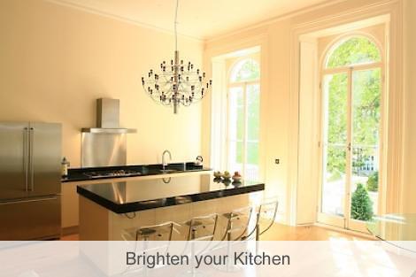 Image of a bright ground floor island kitchen area.