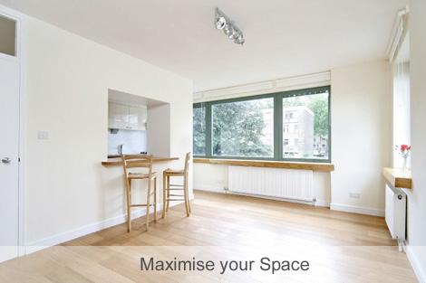 Image of open room with stools at a breakfast bar.